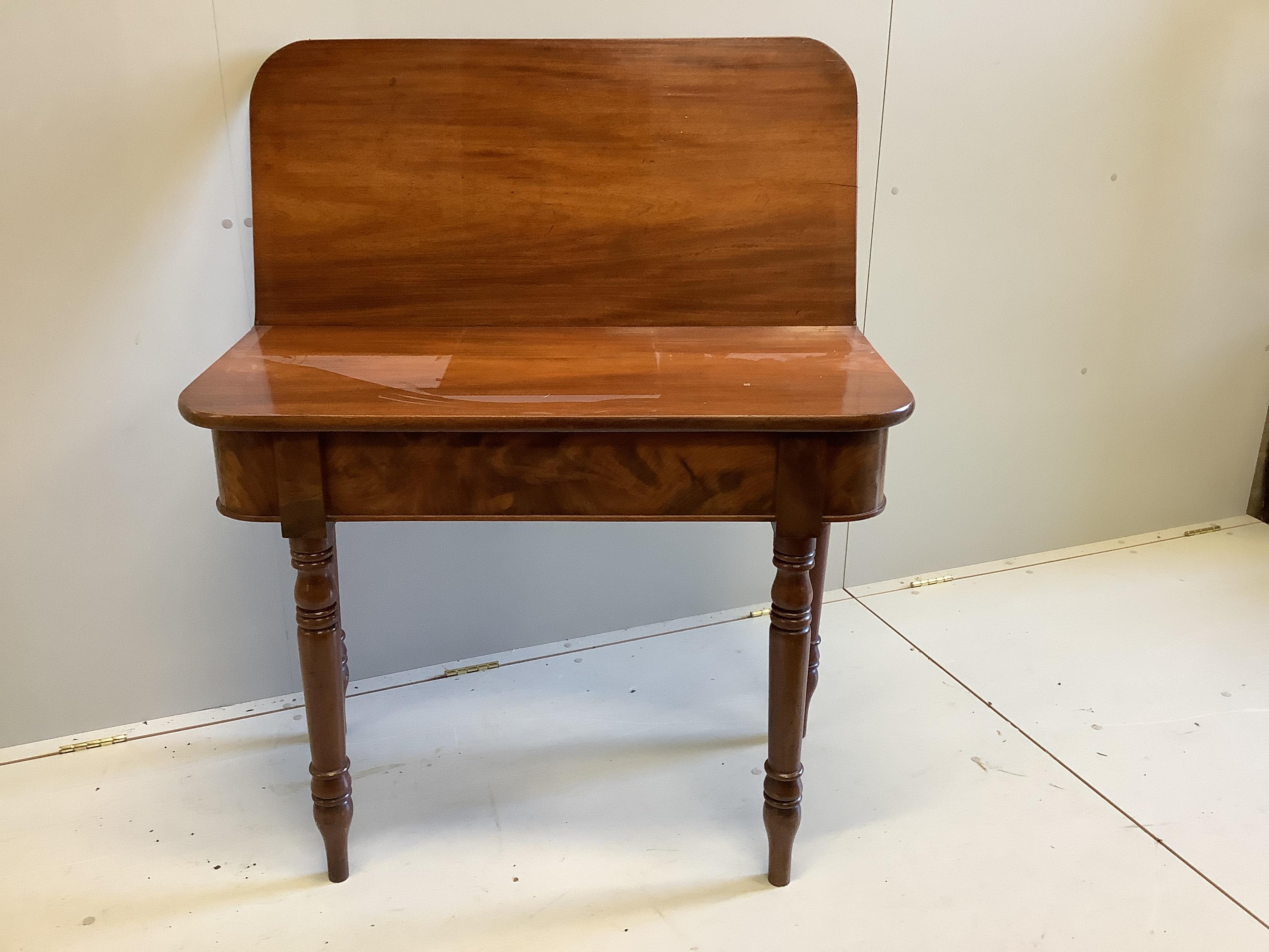 An early Victorian rectangular mahogany folding tea table, width 96cm, depth 45cm, height 77cm